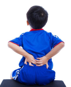 young boy with back pain